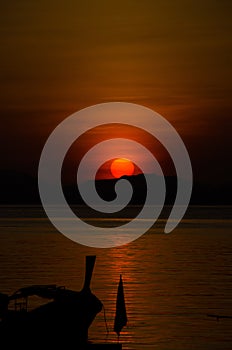 Longtail boat on the sea at sunriseÂ in Adang-Ravi Islandsin,Tarutao National Park, Satun Thailand